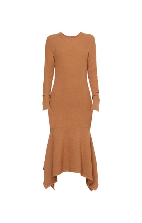 Etcetera clothing - Etcetera - FALL 2023 - Catalog - 15 This denim-friendly knit polo top is a casual imperative. Its heathered shades of tea rose pink and meerkat brown go perfectly with the light pink and umber of this posh, eight-color tweed skirt.